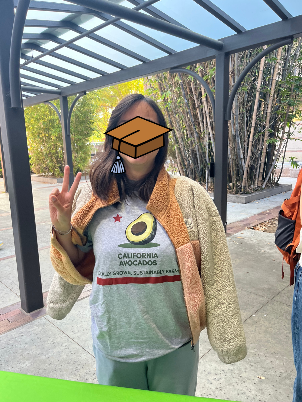 USC Student who won a student-designed California Avocado flag t-shirt during the lunch period, returned at the dinner period with a friend and proudly wearing her t-shirt.