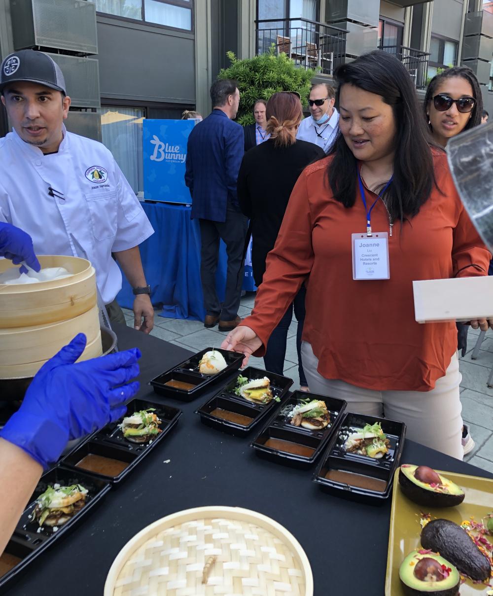 Flavor Experience attendees at the California Avocado Commission food station.