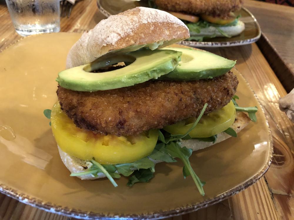 This menu concept consists of cheesy mashed cauliflower fried into a burger and topped with fresh California avocados and summer tomatoes.