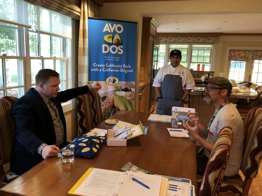 Jason Hernandez (center) and Alexei Rudolf (right) walk through the flavor building exercise, pairing spices with California avocados.