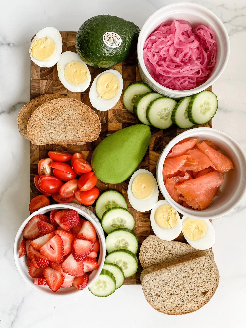 Hannah Kling’s’ California Avocado Brunch Charcuterie Board makes it easy to impress guests with minimal effort by combining hardboiled eggs, cucumbers, strawberries, tomatoes, pickled onions, toast, smoked salmon and beautiful California avocado halves.