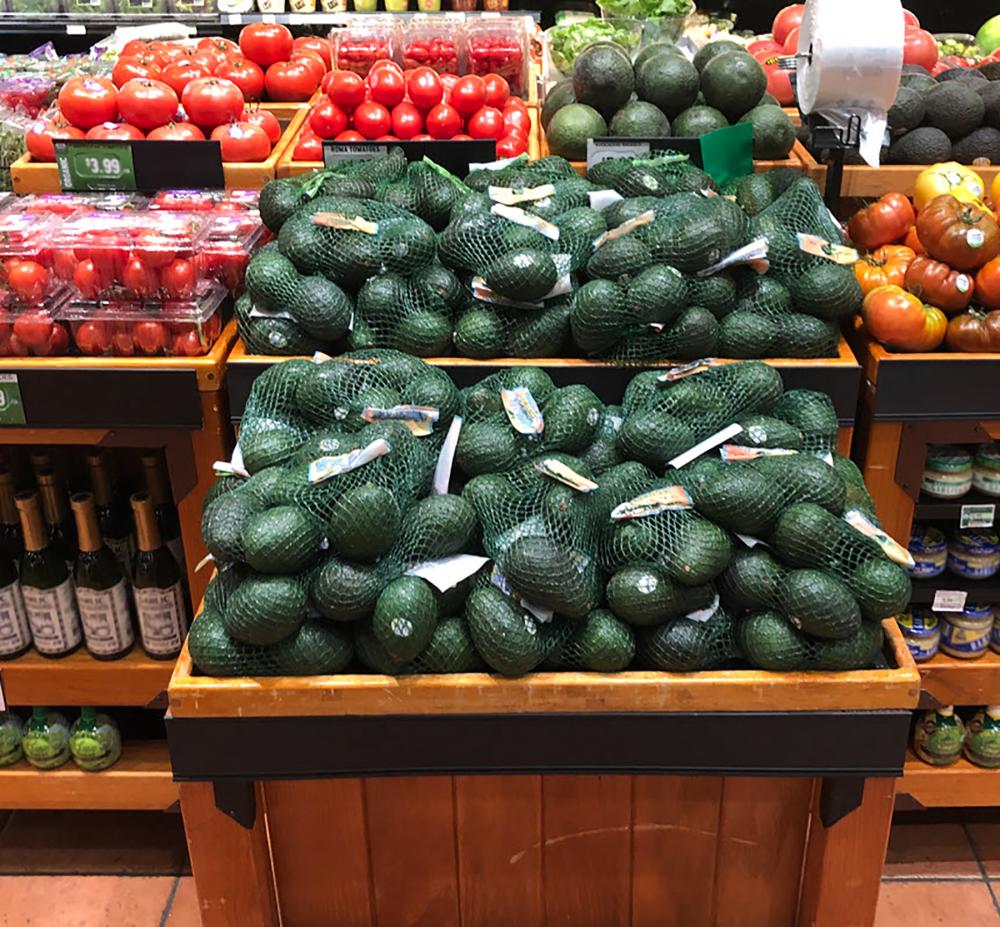 Bulk end cap displays featured California avocados during peak season in Fresh Market stores.