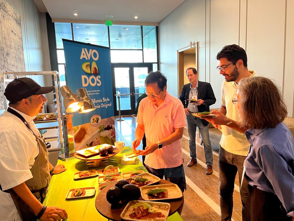 Ken Toong, Executive Director, UMass Amherst helped himself to the California Avocado Frico-Cado Toast.