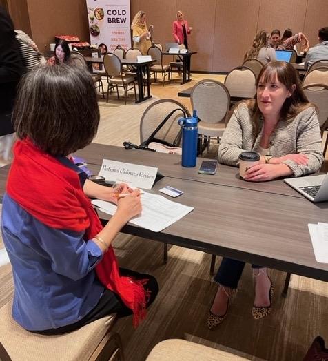 CAC’s Kim Kurata discusses story angles with Amelia Levin, editor of the National Culinary Review.