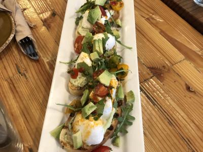 This Avocado Toast prepared Urban Plates’ style features fresh vegetables, herbs, poached eggs and premium California avocados.