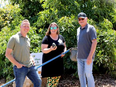 California avocado growers Chris Ambuul and Mike Sanders with reporter Pamela Riemenschneider showing off the avocado she picked.